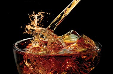 Bourbon Splashing in Glass