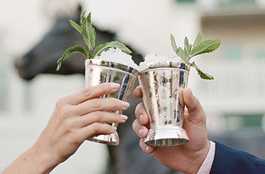 Toasting with a mint julep at Churchill Downs