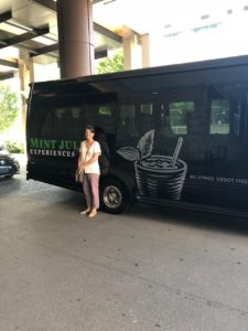 Guest in front of Mint Julep Experiences tour buses in Nashville