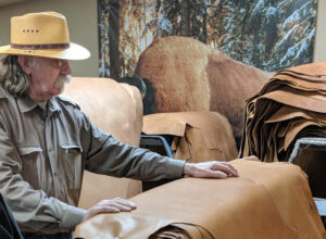 Col. Littleton explains the process for bison leather