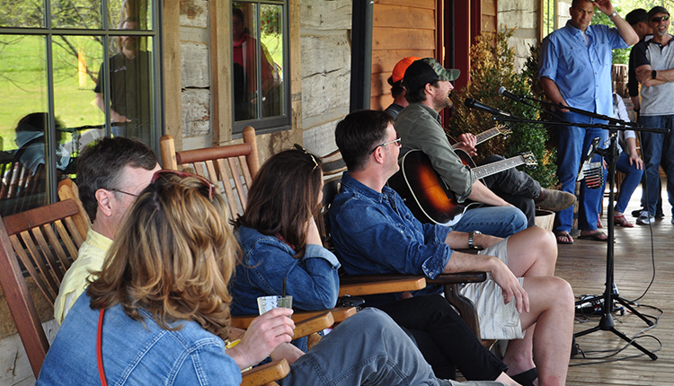 Group Tour on Porch at Leiper's Fork Distillery Listening to Country Music