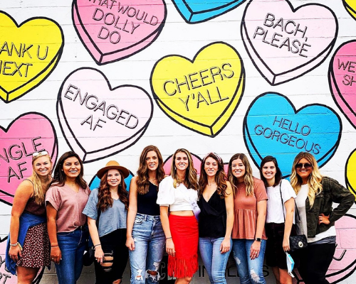 girls posing in front of Nashville mural photo