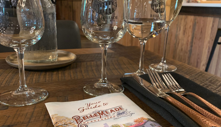 wine glasses and a guide to belle meade on a wine and chocolate tasting tour
