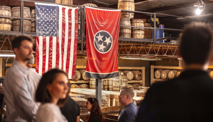 USA and Tennessee flags hanging in the Pennington Distillery space