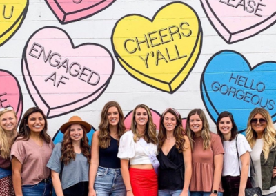 girls in front of nashville hearts murals