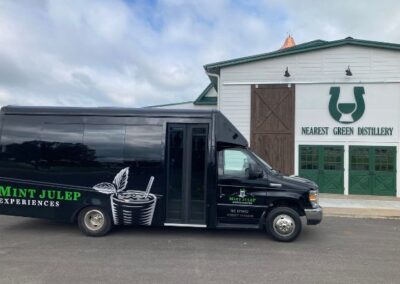 mint julep experiences bus in front of nearest green distillery