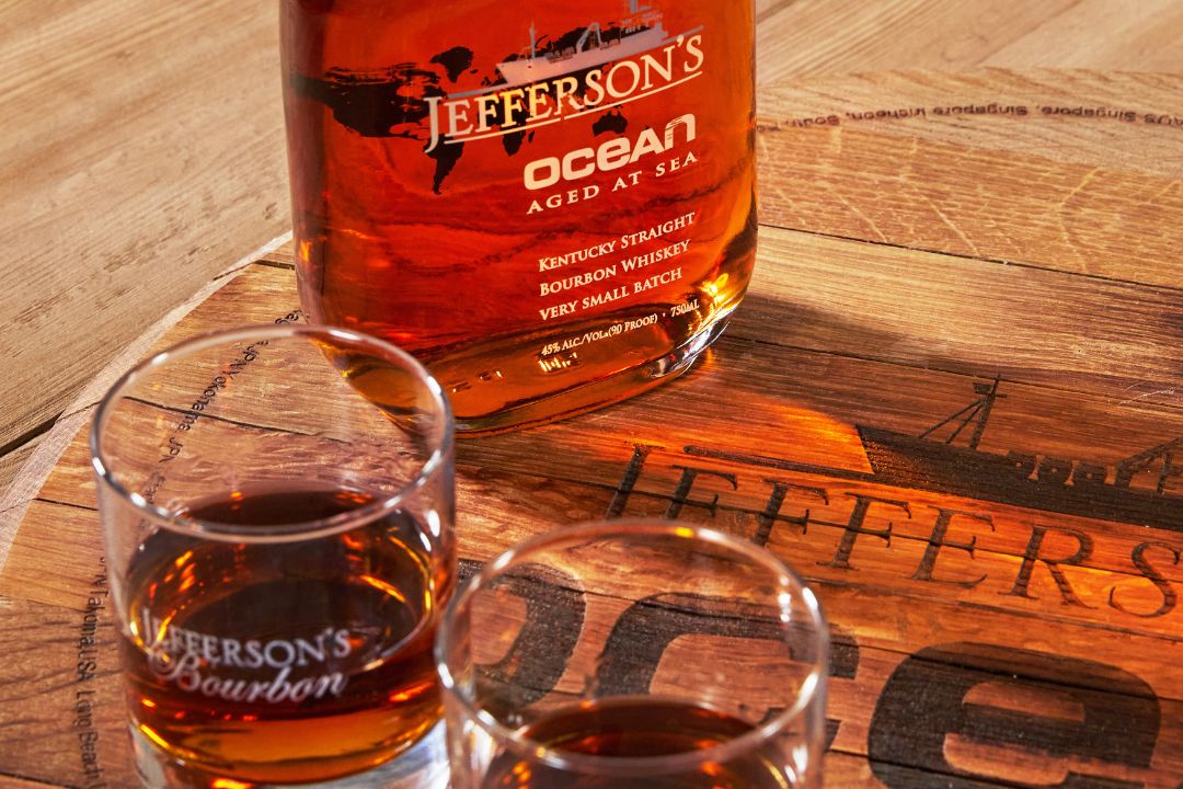bottle of Jefferson's Ocean aged at sea bourbon with glasses