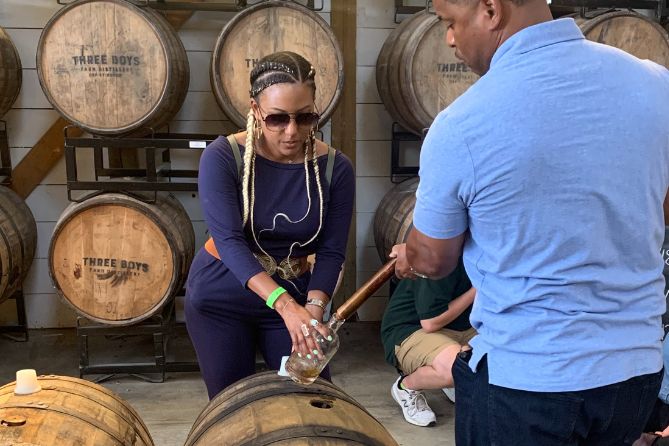 couple thieving bourbon from a barrel