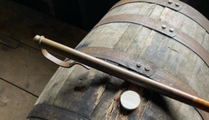 bourbon barrel and whiskey thief