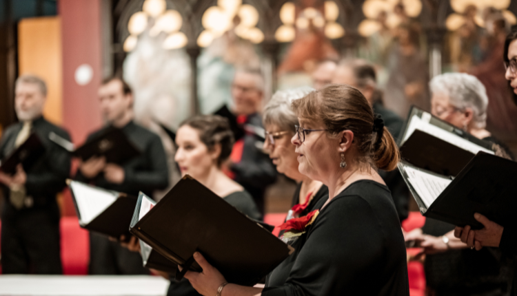 Group of people singing carols